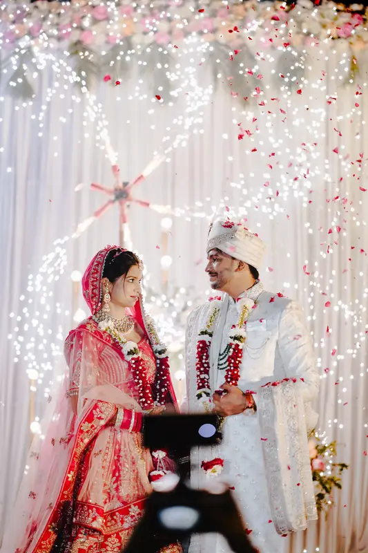 Priya and Utkarsh under a floral mandap